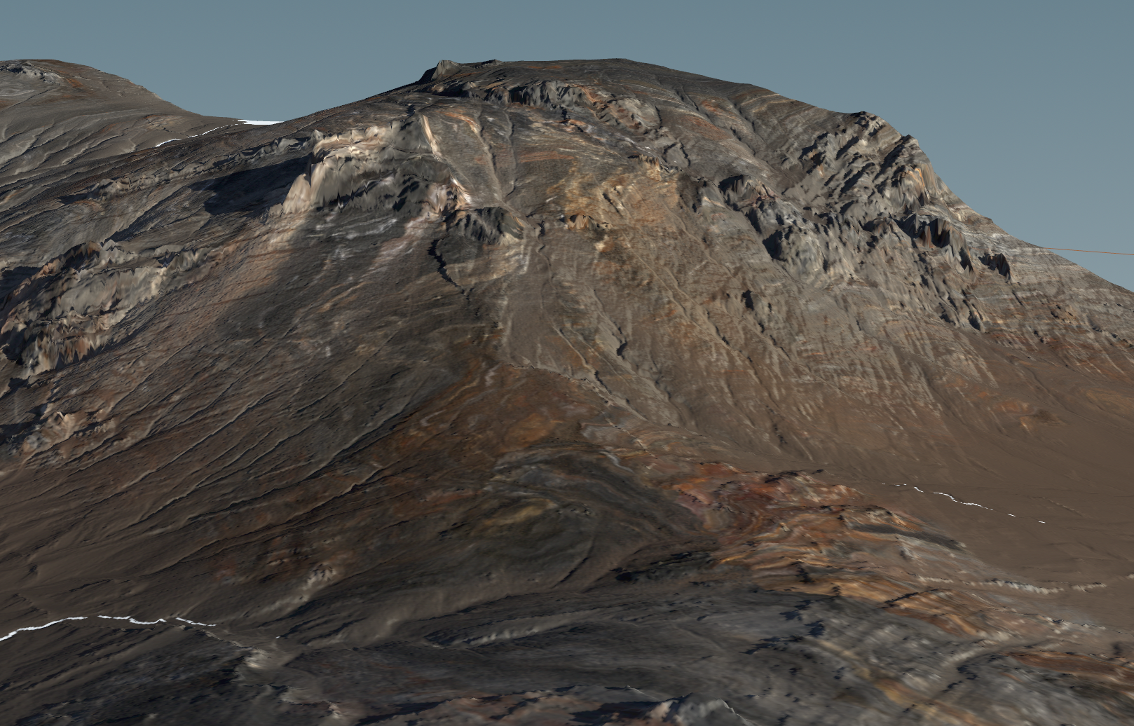 Close view of a rocky mountain face with stratified bands