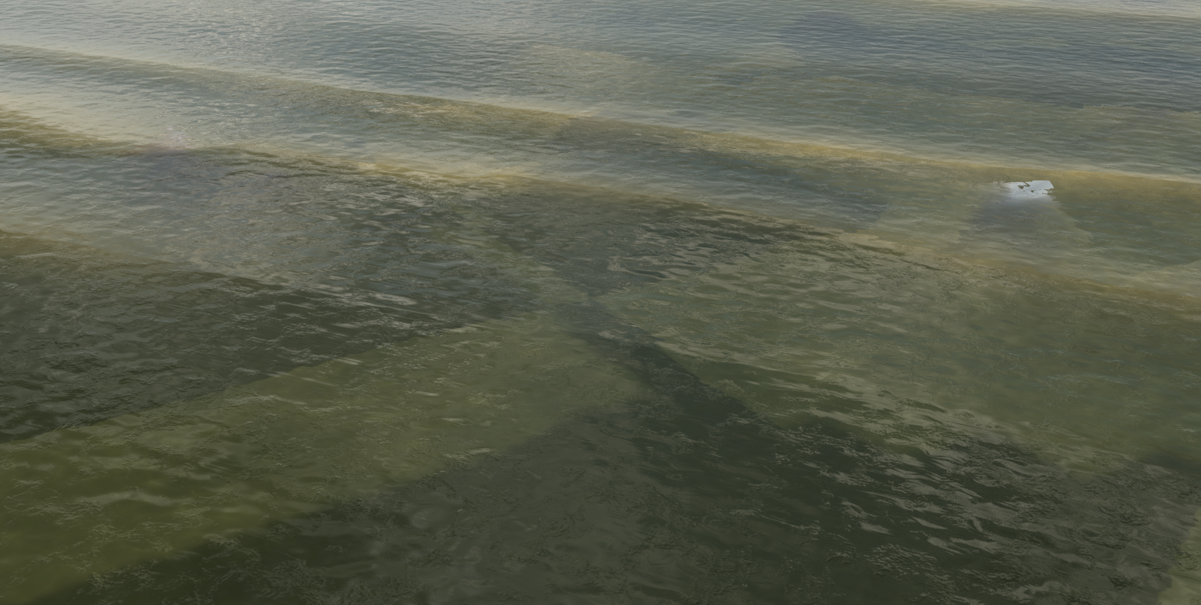 Shallow water over a sand bar, with the bottom visible through it